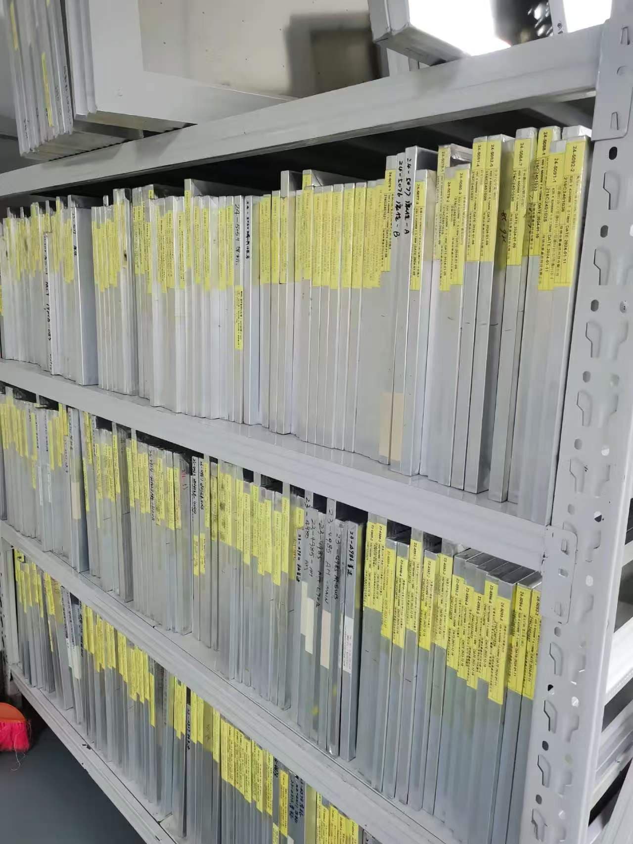 PCBA engineer reviewing BOM files and assembled circuit boards